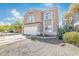 Two-story home featuring a two-car garage, desert landscaping and tile roof at 9143 W Harmony Ln, Peoria, AZ 85382