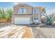Two-story home featuring a two-car garage, desert landscaping and tile roof at 9143 W Harmony Ln, Peoria, AZ 85382