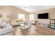 Comfortable living room with neutral color palette and ample seating at 9143 W Harmony Ln, Peoria, AZ 85382