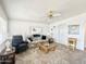 Bright living room featuring a sofa, armchair, and coffee table at 755 S Diamond Dr, Apache Junction, AZ 85119