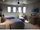 Bright bedroom with two beds, multiple windows for natural light, and ceiling fan at 11108 E Mariola Way, Scottsdale, AZ 85262