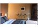 Neutral bedroom featuring a decorative cabinet and bedside lamp at 11108 E Mariola Way, Scottsdale, AZ 85262