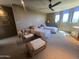 Inviting bedroom with twin beds, a comfortable chair, and natural light at 11108 E Mariola Way, Scottsdale, AZ 85262
