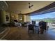 Inviting living room with a fireplace, tile floors, ceiling fan, and expansive glass windows with views at 11108 E Mariola Way, Scottsdale, AZ 85262