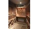 Custom wine cellar with built-in racks for ample bottle storage and tile flooring at 11108 E Mariola Way, Scottsdale, AZ 85262