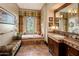 Bathroom with soaking tub and double vanity at 26761 N 98Th Way, Scottsdale, AZ 85262