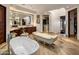 Elegant bathroom with free-standing tub, walk-in shower, and and vanities at 26761 N 98Th Way, Scottsdale, AZ 85262