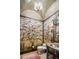 Elegant bathroom features hand-painted wall mural and granite vanity at 26761 N 98Th Way, Scottsdale, AZ 85262