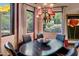 Elegant dining room with a dark wood table and stunning views at 26761 N 98Th Way, Scottsdale, AZ 85262