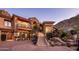 Elegant home entrance with a curved staircase and mountain views at 26761 N 98Th Way, Scottsdale, AZ 85262