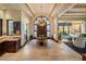 Elegant entryway with a beautiful chandelier and ornate front door at 26761 N 98Th Way, Scottsdale, AZ 85262