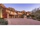 Stunning estate home exterior with a large driveway and mountain backdrop at 26761 N 98Th Way, Scottsdale, AZ 85262
