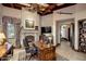 Spacious home office with fireplace and built-in desk at 26761 N 98Th Way, Scottsdale, AZ 85262