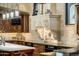 Kitchen features ornate range hood and custom cabinetry at 26761 N 98Th Way, Scottsdale, AZ 85262