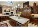 Island kitchen with granite countertops and dark wood cabinetry at 26761 N 98Th Way, Scottsdale, AZ 85262
