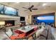 Spacious living room with fireplace, large windows, and city views at 26761 N 98Th Way, Scottsdale, AZ 85262