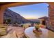 Covered patio with mountain and city views, adjacent to pool at 26761 N 98Th Way, Scottsdale, AZ 85262