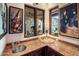 Wet bar with granite countertop, sink, and plenty of cabinet space at 26761 N 98Th Way, Scottsdale, AZ 85262