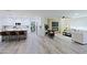Modern kitchen with island and white cabinetry at 17407 N 130Th Dr, Sun City West, AZ 85375