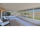 Relaxing screened porch with tile floor and backyard view at 17407 N 130Th Dr, Sun City West, AZ 85375