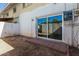 Backyard with sliding door and access to storage shed with paver design at 1673 W Hazelwood St, Phoenix, AZ 85015