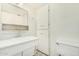 Clean bathroom with a white vanity, sink, mirror, storage cabinet, and toilet at 1673 W Hazelwood St, Phoenix, AZ 85015