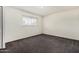 Bedroom with neutral carpet and a window at 1673 W Hazelwood St, Phoenix, AZ 85015
