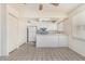 Modern kitchen with white cabinets and appliances, offering a clean and functional space at 1673 W Hazelwood St, Phoenix, AZ 85015