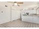 Bright kitchen with white appliances, cabinets and tiled floor, ready for culinary adventures at 1673 W Hazelwood St, Phoenix, AZ 85015