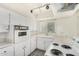 Efficient kitchen featuring a bright window and a functional layout for cooking and food preparation at 1673 W Hazelwood St, Phoenix, AZ 85015