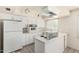 Functional kitchen with retro-style appliances and abundant cabinet space, ready for home cooking at 1673 W Hazelwood St, Phoenix, AZ 85015