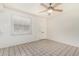 Airy living area with tile flooring and a ceiling fan, ideal for creating a relaxing space at 1673 W Hazelwood St, Phoenix, AZ 85015