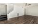 Cozy living room with wood flooring and staircase at 1673 W Hazelwood St, Phoenix, AZ 85015