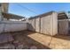 Outdoor shed for extra storage in fenced backyard with pavers at 1673 W Hazelwood St, Phoenix, AZ 85015