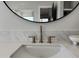 Modern bathroom sink with a round mirror and marble countertops at 3525 S Kings Ranch Ct # 4, Gold Canyon, AZ 85118