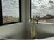 Luxurious bathtub featuring a gold faucet and desert views through a large window at 3525 S Kings Ranch Ct # 4, Gold Canyon, AZ 85118