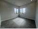 Bright bedroom with tile floors and dual windows overlooking the mountain at 3525 S Kings Ranch Ct # 4, Gold Canyon, AZ 85118