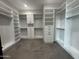 Walk-in closet featuring custom shelving, hanging rods, drawers, and tile floors at 3525 S Kings Ranch Ct # 4, Gold Canyon, AZ 85118