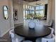 Open dining room with dark wood table and seating at 3525 S Kings Ranch Ct # 4, Gold Canyon, AZ 85118