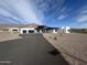 Modern home with black accents, a driveway, desert landscaping, and mountain views at 3525 S Kings Ranch Ct # 4, Gold Canyon, AZ 85118