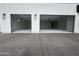 Modern home with a large open garage featuring lighting and black trim at 3525 S Kings Ranch Ct # 4, Gold Canyon, AZ 85118