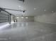 Large garage interior with epoxy floor, bright lighting, and ample parking at 3525 S Kings Ranch Ct # 4, Gold Canyon, AZ 85118