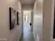 Bright hallway with contemporary artwork and tile flooring at 3525 S Kings Ranch Ct # 4, Gold Canyon, AZ 85118