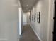 Bright hallway with modern artwork and tile flooring at 3525 S Kings Ranch Ct # 4, Gold Canyon, AZ 85118