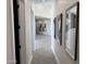 Bright hallway with modern art and grey flooring at 3525 S Kings Ranch Ct # 4, Gold Canyon, AZ 85118