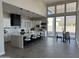 Modern kitchen features white cabinetry, breakfast bar, and views at 3525 S Kings Ranch Ct # 4, Gold Canyon, AZ 85118