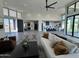 Open living area with modern furniture and high ceilings, showcasing a kitchen and views at 3525 S Kings Ranch Ct # 4, Gold Canyon, AZ 85118
