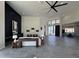 Elegant living room with dark accent wall and access to other areas at 3525 S Kings Ranch Ct # 4, Gold Canyon, AZ 85118