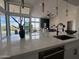 Bright living room with quartz countertops, an undermount sink, and views of the desert landscape at 3525 S Kings Ranch Ct # 4, Gold Canyon, AZ 85118