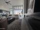 Open concept living area with modern fireplace, views of the desert landscape, and a gourmet kitchen at 3525 S Kings Ranch Ct # 4, Gold Canyon, AZ 85118